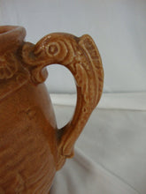 Load image into Gallery viewer, Early Unmarked McCoy Orange Stoneware Water Lily Pitcher with Fish Handle
