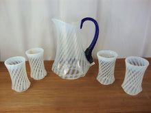 Load image into Gallery viewer, 1985 85th Anniversary Fenton Optic Opal Swirl with Cobalt Blue Handle Pitcher & Four Tumblers