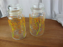 Load image into Gallery viewer, Vintage Anchor Hocking Clear Glass Yellow Green Tree Motif Canisters with Lids
