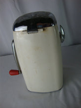 Load image into Gallery viewer, MCM retro Ice O Mat hand crank ice crusher with cream and red metal and plastic body with chrome flip top lid and handle. Crusher has wear/tear, finish loss, scratches, stains and measures about 8" height by 5" width by 4" depth.