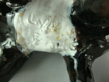 Load image into Gallery viewer, Lynn Bailey Folk Art Pottery Black White Bull Tan Pig on Back Cardinal on Neck 5 Inch Figurine