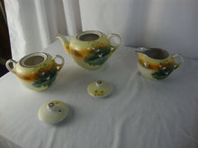 Load image into Gallery viewer, Vintage Japan Handpainted Teapot Creamer Sugar Set Bird over Marsh Motif