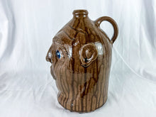 Load image into Gallery viewer, Large Mike Craven Signed Brown Ugly Face Jug with Big Round Blue Eyes