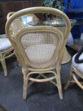 Load image into Gallery viewer, Vintage Washed Rattan Dining Table with Glass Top and Four Upholstered Dining Chairs Cane Backs
