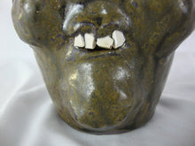 Load image into Gallery viewer, Harold &amp; Grace Hewell 1999 Signed Folk Art Moss Green Ugly Face Jug
