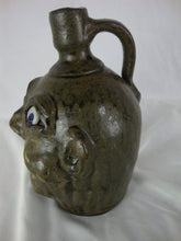 Load image into Gallery viewer, Harold &amp; Grace Hewell 1999 Signed Folk Art Moss Green Ugly Face Jug
