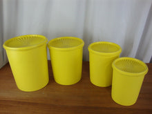 Load image into Gallery viewer, Vintage Tupperware Lemon Yellow Plastic Nesting Kitchen Canister Set of 4 with Lids
