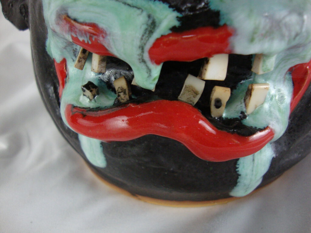 Marvin Bailey Pottery Dark Body with Aqua Crying Eyes Red Clown Lips Wonky Teeth Ugly Face Jug