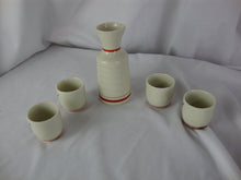 Load image into Gallery viewer, Vintage Japan Ceramic Floral Cart Sake Set with Four Cups and Decanter
