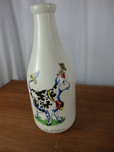 Load image into Gallery viewer, Vintage Ile d&#39;Orlians Quebec Ceramic Cow with Bell Milk Bottle

