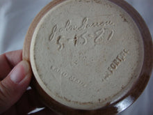 Load image into Gallery viewer, 1987 John Garrou Old Fort Pottery Tan Drip Glaze Small Finger Loop Jar with Attached Plate

