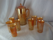 Load image into Gallery viewer, Vintage Jeanette Glass Marigold Carnival Treebark Beverage Pitcher with Lid and Eight Glasses Set
