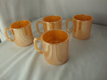 Load image into Gallery viewer, 1950s Fire King Peach Luster Tom &amp; Jerry Holiday Mugs Set of 4
