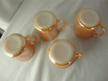 Load image into Gallery viewer, 1950s Fire King Peach Luster Tom &amp; Jerry Holiday Mugs Set of 4
