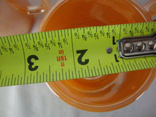 Load image into Gallery viewer, 1950s Fire King Peach Luster Tom &amp; Jerry Holiday Mugs Set of 4
