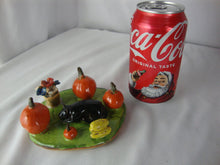 Load image into Gallery viewer, Lynn Bailey Folk Art Pottery Black Cat with Pumpkins and Flowers Figurine

