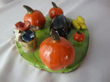 Load image into Gallery viewer, Lynn Bailey Folk Art Pottery Black Cat with Pumpkins and Flowers Figurine
