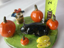 Load image into Gallery viewer, Lynn Bailey Folk Art Pottery Black Cat with Pumpkins and Flowers Figurine
