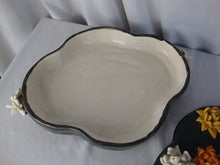Load image into Gallery viewer, Handmade USA Pottery Footed Shallow Clover Shape Dish with Swan Flower Motif
