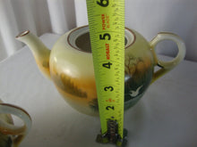 Load image into Gallery viewer, Vintage Japan Handpainted Teapot Creamer Sugar Set Bird over Marsh Motif
