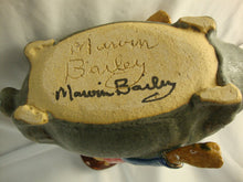 Load image into Gallery viewer, Marvin Bailey Artist Signed Cowboy Farmer with Mini Ugly Face Jug on Green Specked Pig Stack

