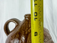 Load image into Gallery viewer, Large Mike Craven Signed Brown Ugly Face Jug with Big Round Blue Eyes
