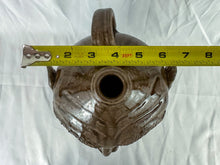Load image into Gallery viewer, Large Mike Craven Signed Brown Ugly Face Jug with Big Round Blue Eyes
