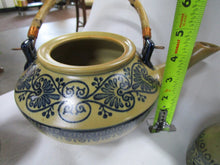 Load image into Gallery viewer, Vintage Porcelain Tan/Blue Floral Teapot with Bamboo Handle and (6) No Handle Tea Cups
