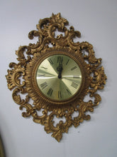 Load image into Gallery viewer, 1955 MCM Burwood Gold Plastic Hollywood Regency Battery Wall Clock with Roman Numerals
