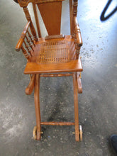 Load image into Gallery viewer, Restored Antique Pressed Back Oak Convertible Wheeled Stroller to High Chair
